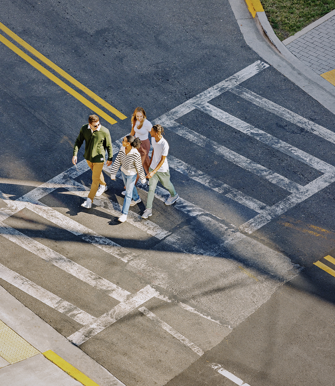 Young adults crossing the street